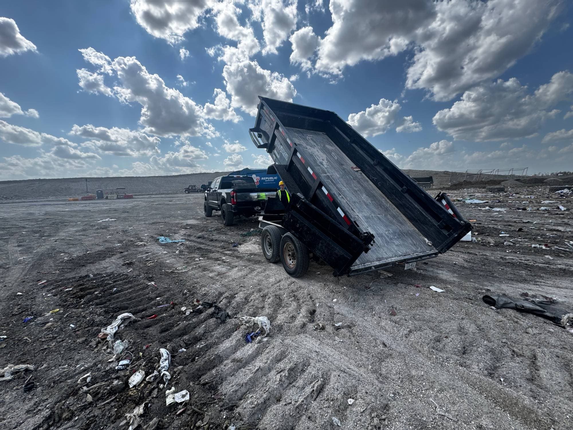HAULR dump trailer raised at disposal facility with F-250 truck in North Texas